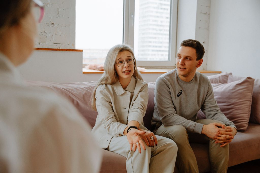 Couple in counselling discussing repeating relationship patterns with a relationship counsellor
